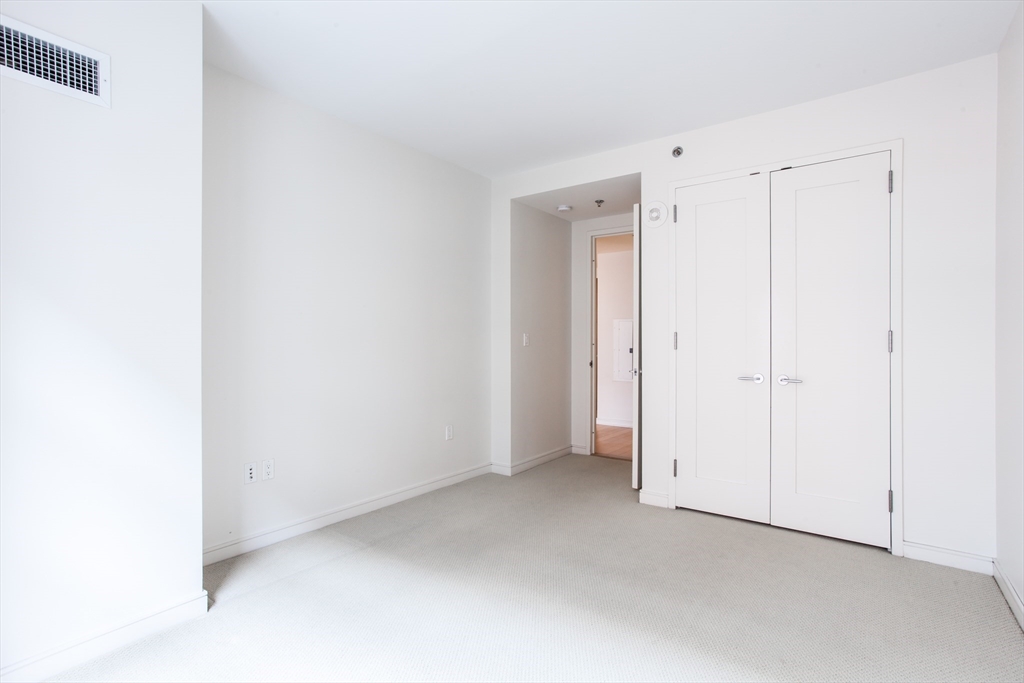 580 Washington Street, Unit 304 Boston, MA 02111 - Photo 14 of 18 a view of an empty room