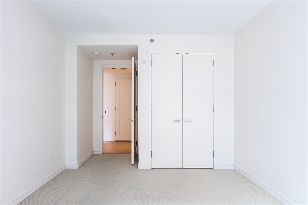 580 Washington Street, Unit 304 Boston, MA 02111 - Photo 15 of 18 a view of room with hallway