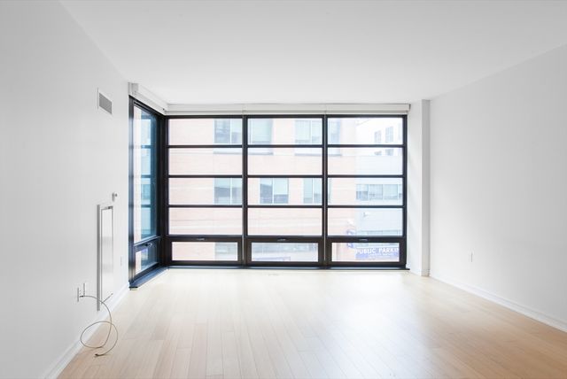 a view of a room with a large window