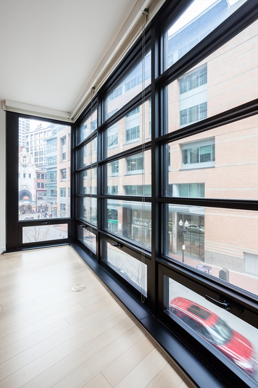 580 Washington Street, Unit 304 Boston, MA 02111 - Photo 5 of 18 a view of empty room with windows