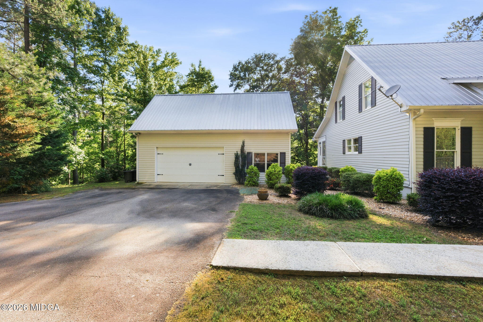 4686 Johnstonville Road Forsyth, GA 31029 - Photo 28 of 34 a house view with a garden space
