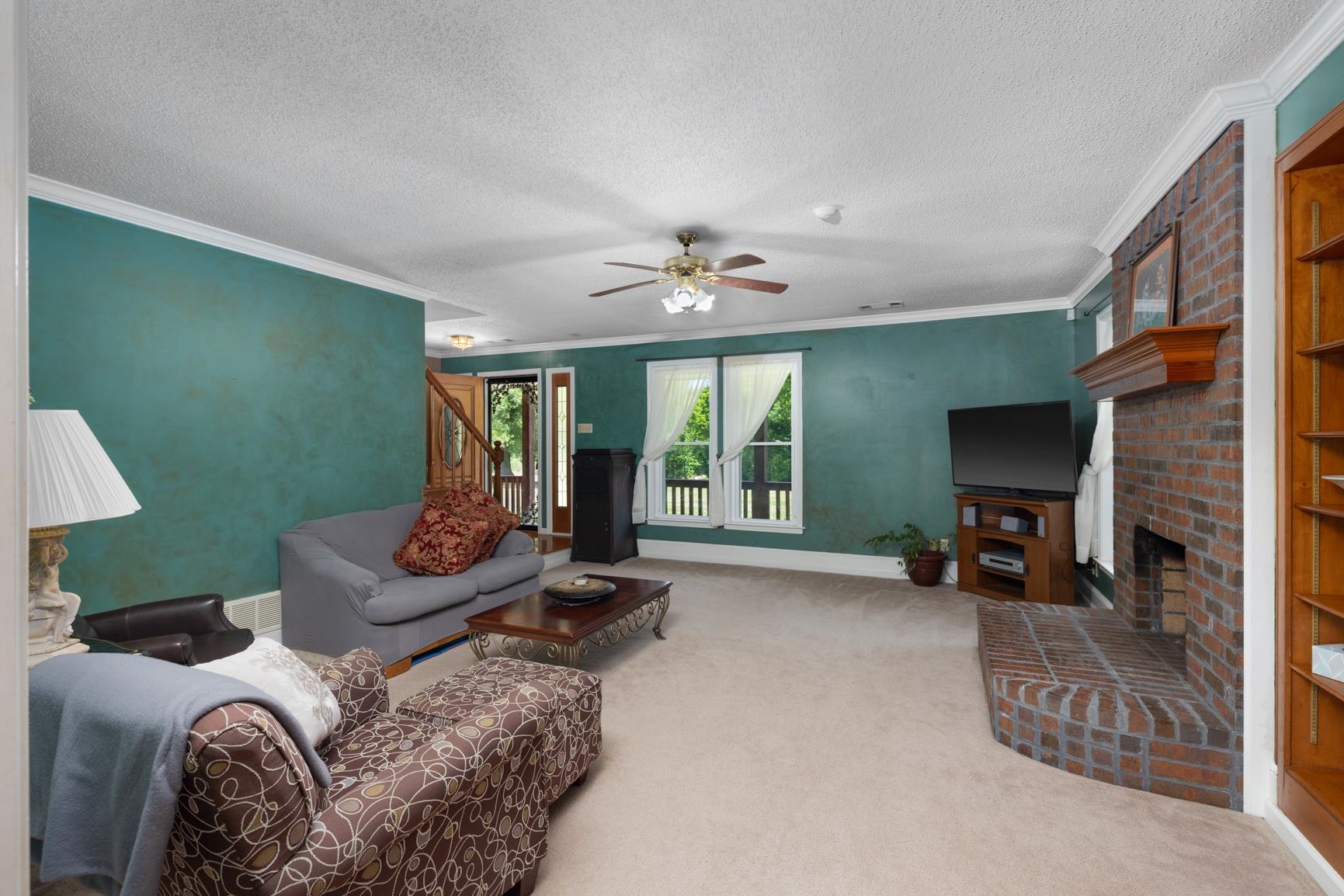 8539 Campground Road Drummonds, TN 38023 - Photo 8 of 38 a living room with furniture and a fireplace