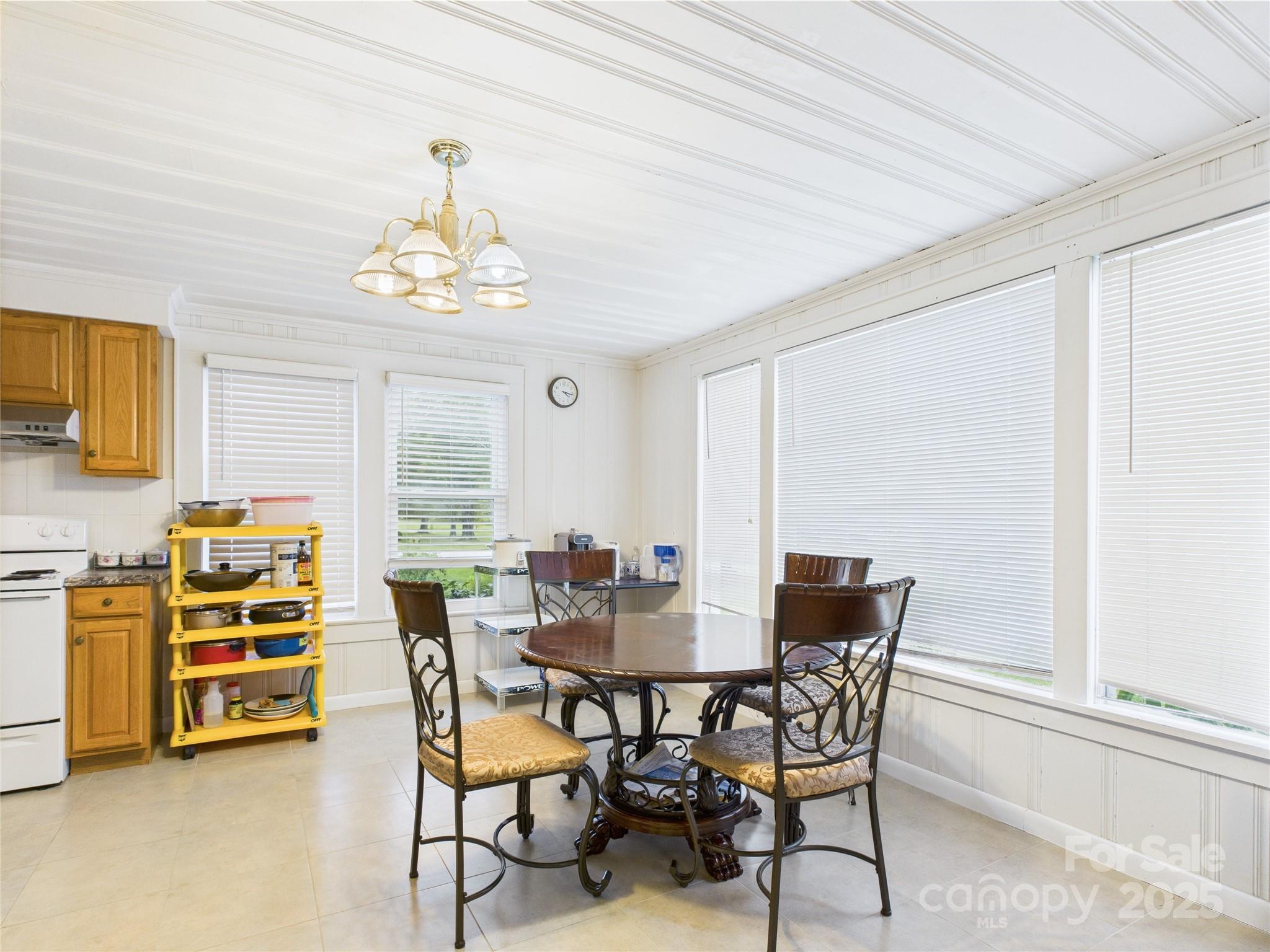 3055 16th Street Northeast Hickory, NC 28601 - Photo 13 of 46 a view of a dining room with furniture and a chandelier