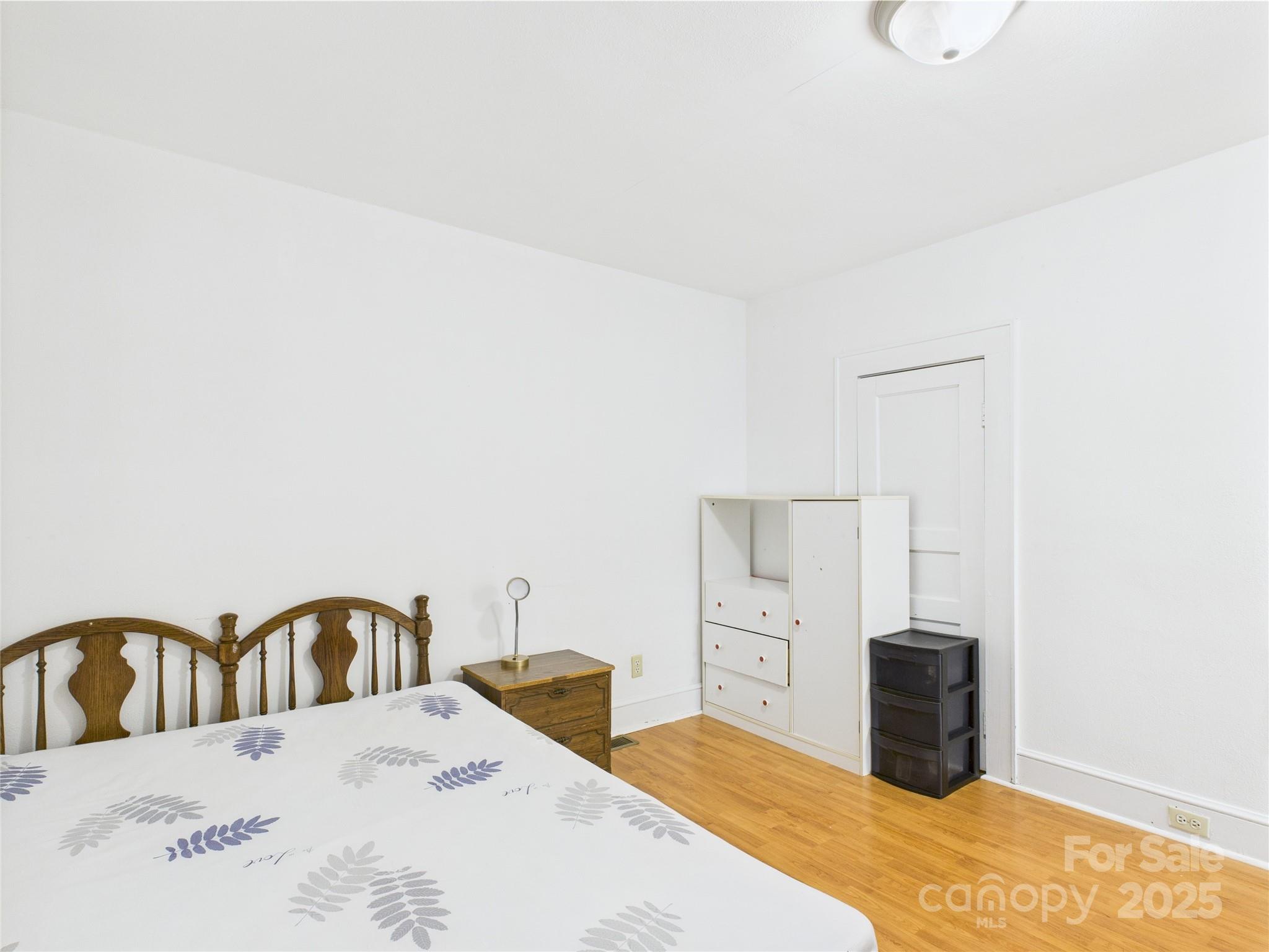 3055 16th Street Northeast Hickory, NC 28601 - Photo 19 of 46 a view of a bedroom with furniture and bathroom