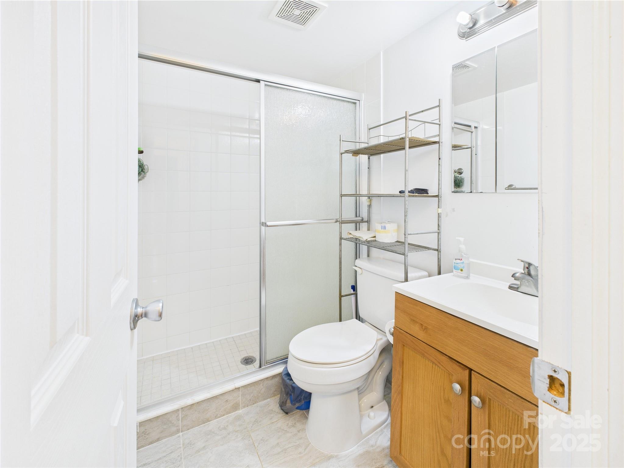 3055 16th Street Northeast Hickory, NC 28601 - Photo 20 of 46 a bathroom with a sink toilet and shower