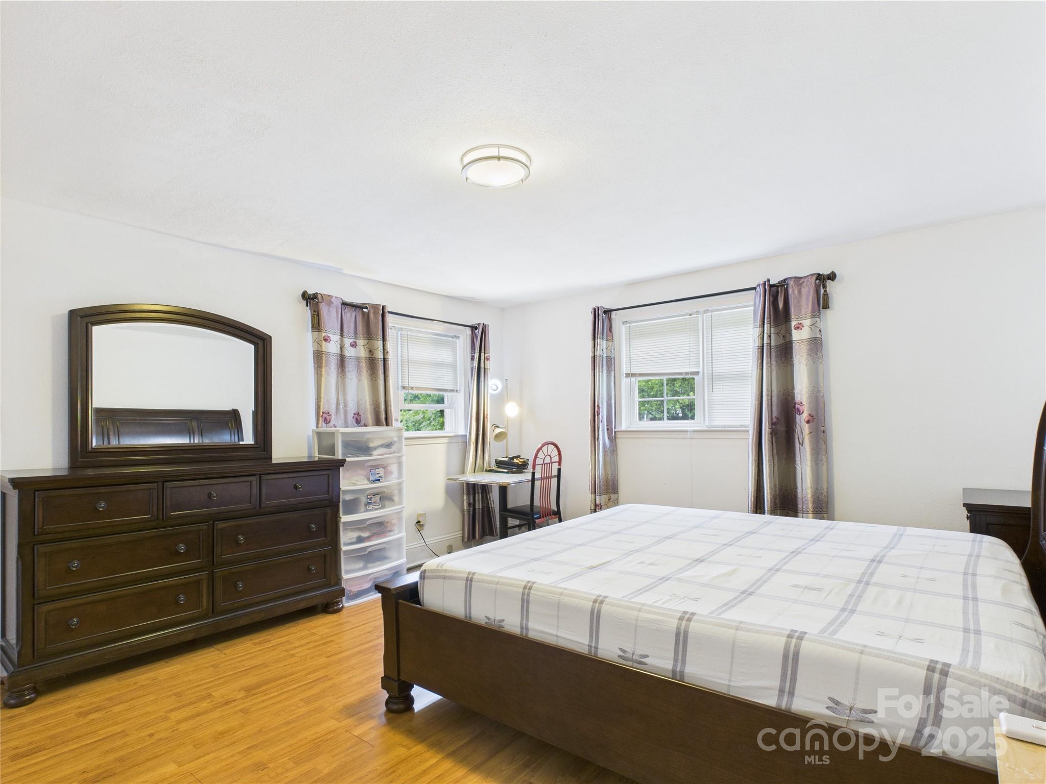 3055 16th Street Northeast Hickory, NC 28601 - Photo 25 of 46 a bedroom with a bed and a dresser