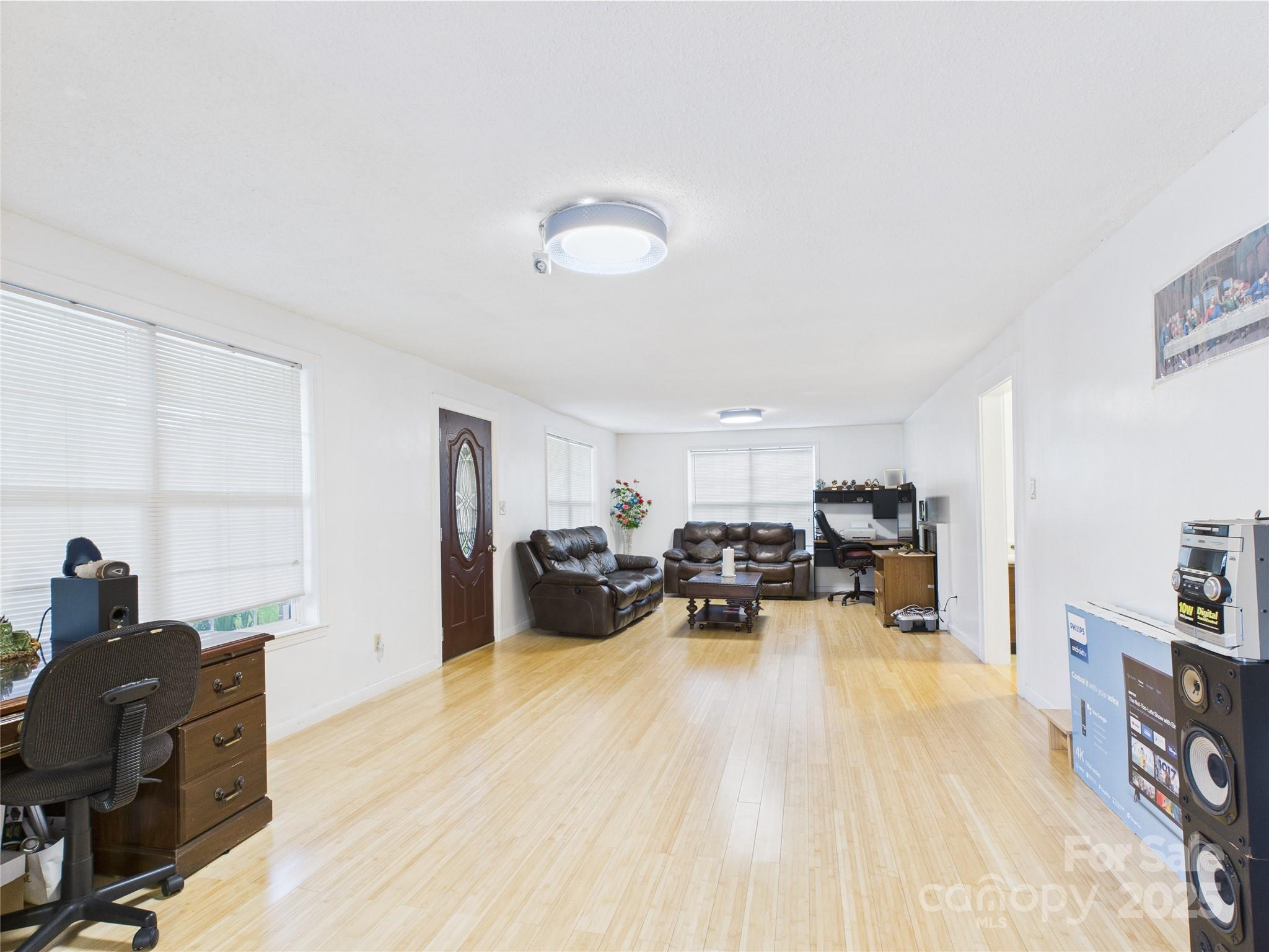3055 16th Street Northeast Hickory, NC 28601 - Photo 4 of 46 a view of a workspace with furniture and a livingroom