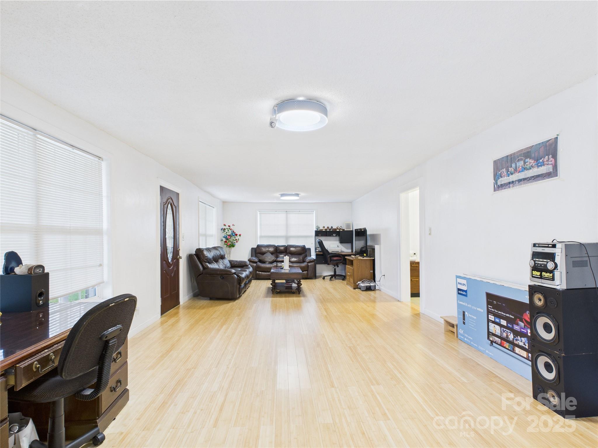 3055 16th Street Northeast Hickory, NC 28601 - Photo 6 of 46 a view of a livingroom with furniture and a flat screen tv