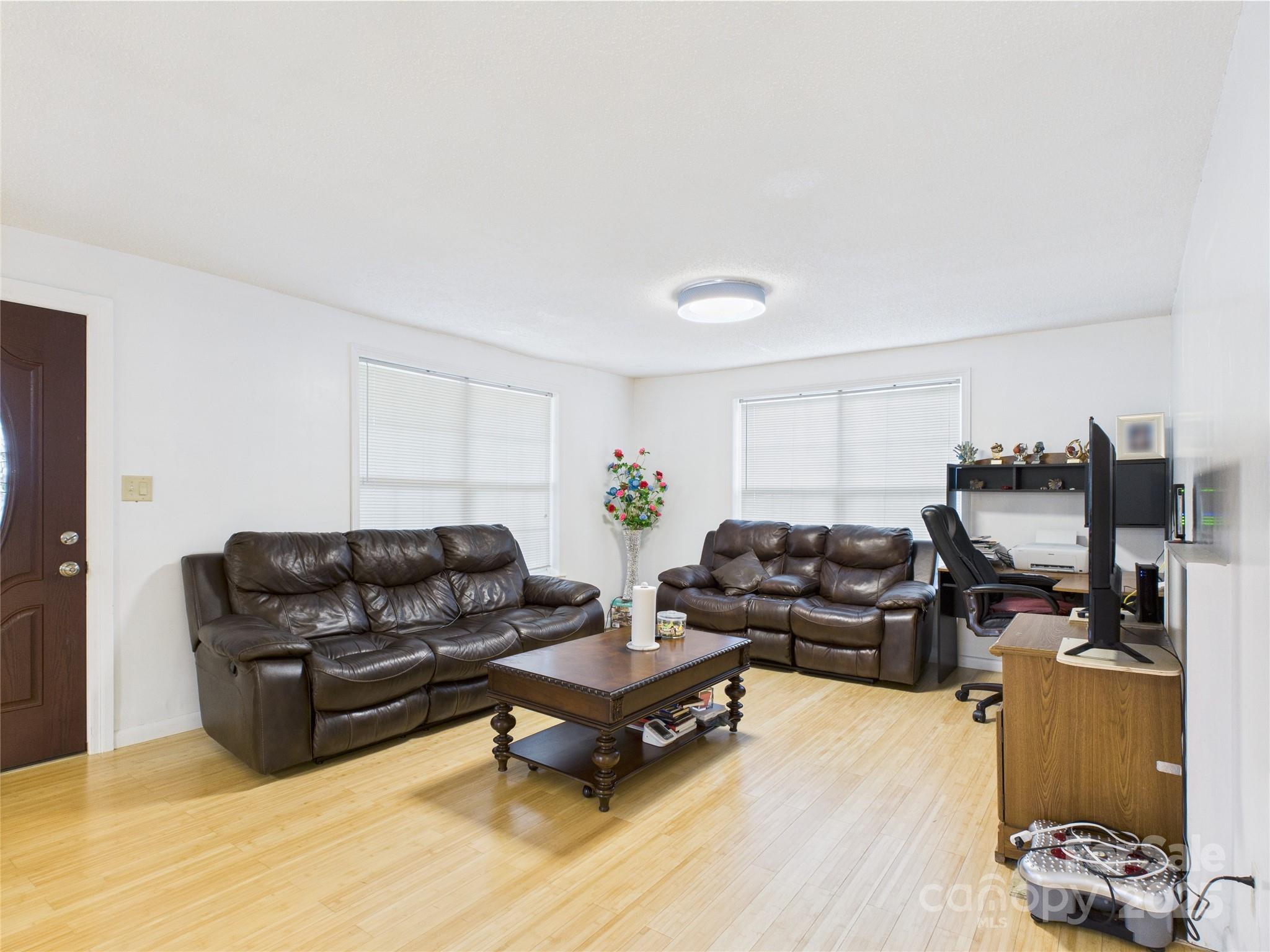 3055 16th Street Northeast Hickory, NC 28601 - Photo 8 of 46 a living room with furniture rug and wooden floor