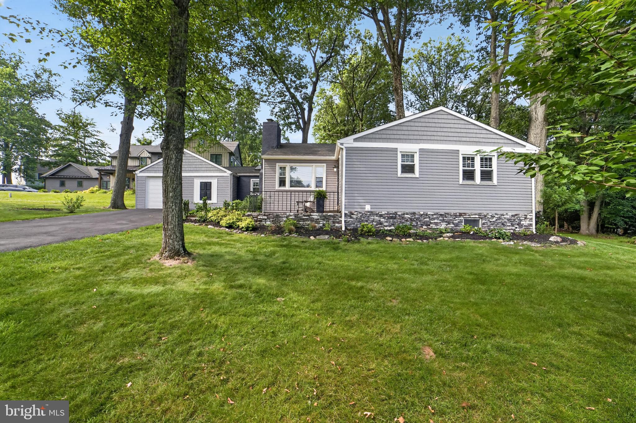305 Irish Road Berwyn, PA 19312 - Photo 1 of 34 a front view of a house with a yard