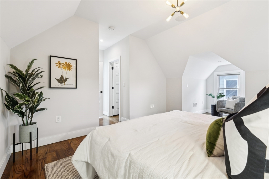26 Robinson Street, Unit 26 Somerville, MA 02145 - Photo 11 of 29 a bedroom with a bed and a potted plant