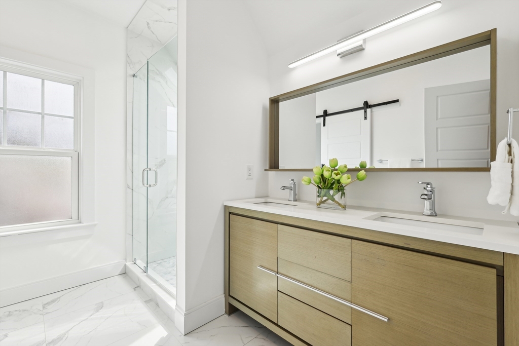 26 Robinson Street, Unit 26 Somerville, MA 02145 - Photo 12 of 29 a bathroom with a sink and a mirror