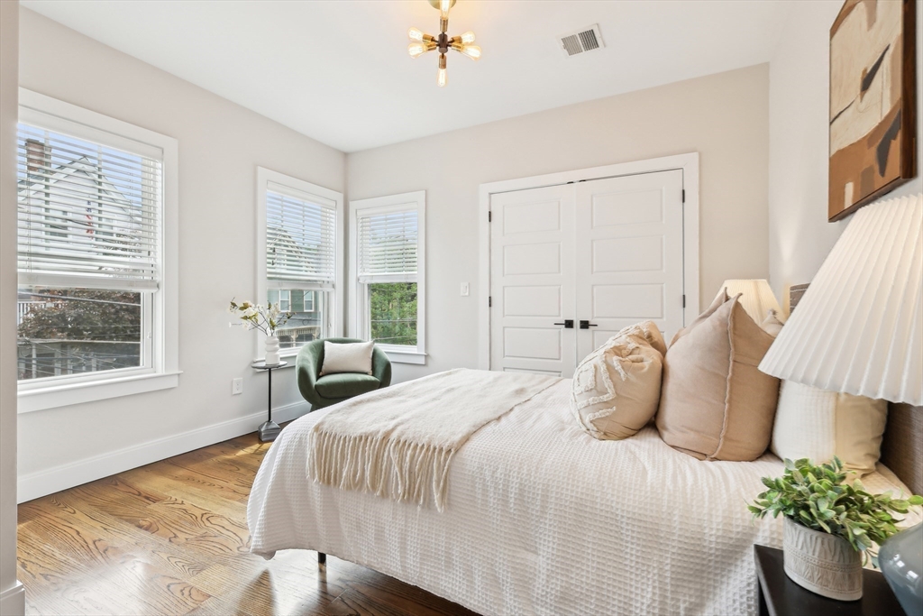 26 Robinson Street, Unit 26 Somerville, MA 02145 - Photo 17 of 29 a bedroom with bed and a window