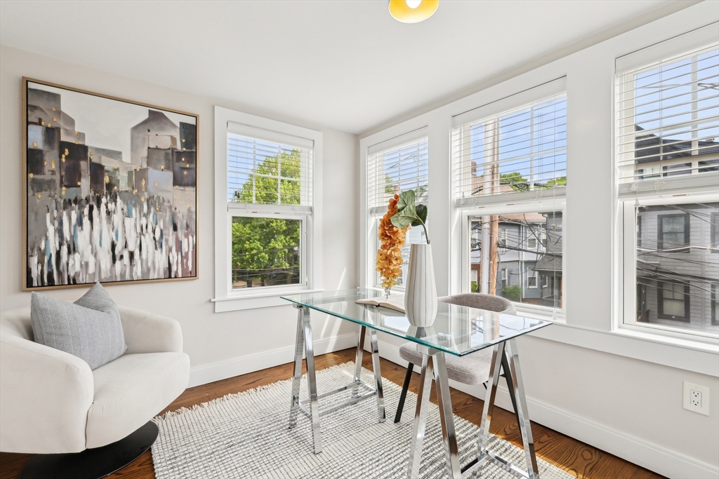26 Robinson Street, Unit 26 Somerville, MA 02145 - Photo 19 of 29 a living room with furniture and a window