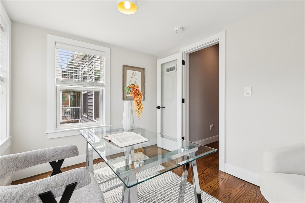 26 Robinson Street, Unit 26 Somerville, MA 02145 - Photo 20 of 29 a living room with furniture and window