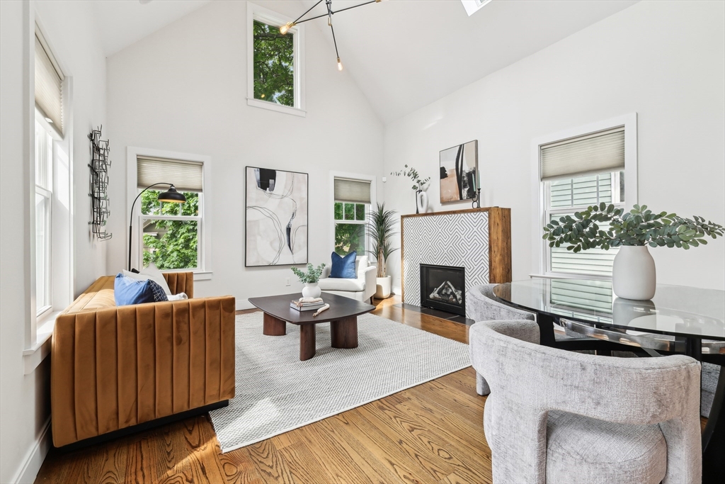 26 Robinson Street, Unit 26 Somerville, MA 02145 - Photo 2 of 29 a living room with furniture and a fireplace