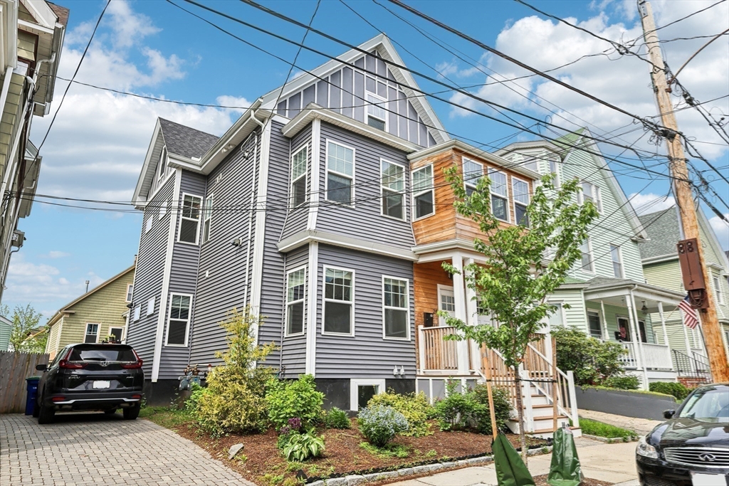 26 Robinson Street, Unit 26 Somerville, MA 02145 - Photo 24 of 29 a car parked in front of a house