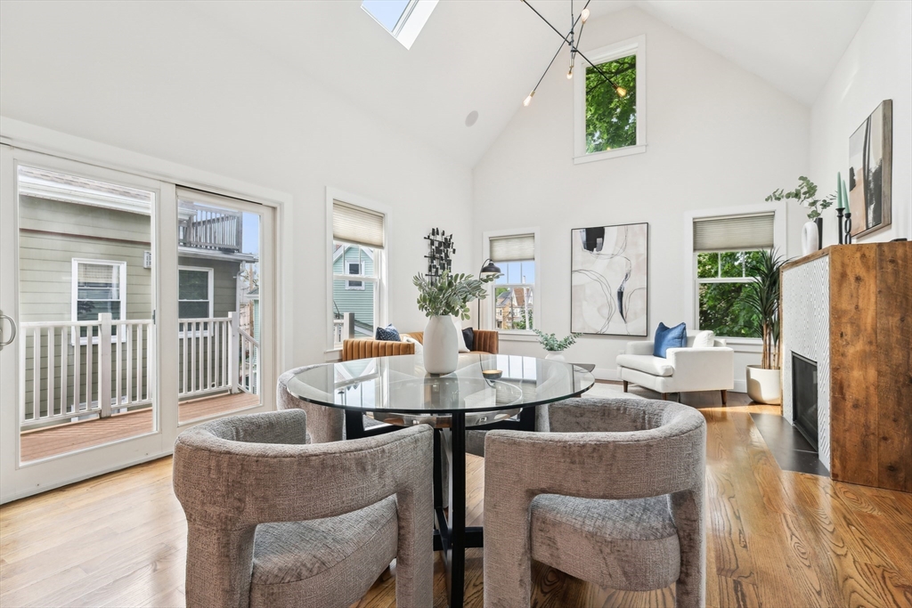 26 Robinson Street, Unit 26 Somerville, MA 02145 - Photo 4 of 29 a dining room with furniture a livingroom and chandelier