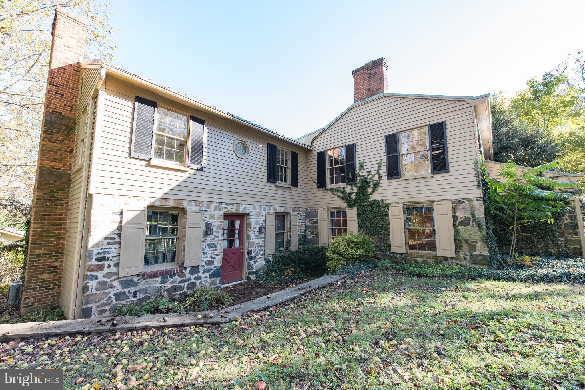 3645 Macalpine Road Ellicott City, MD 21042 - Photo 3 of 30 a front view of a house with garden