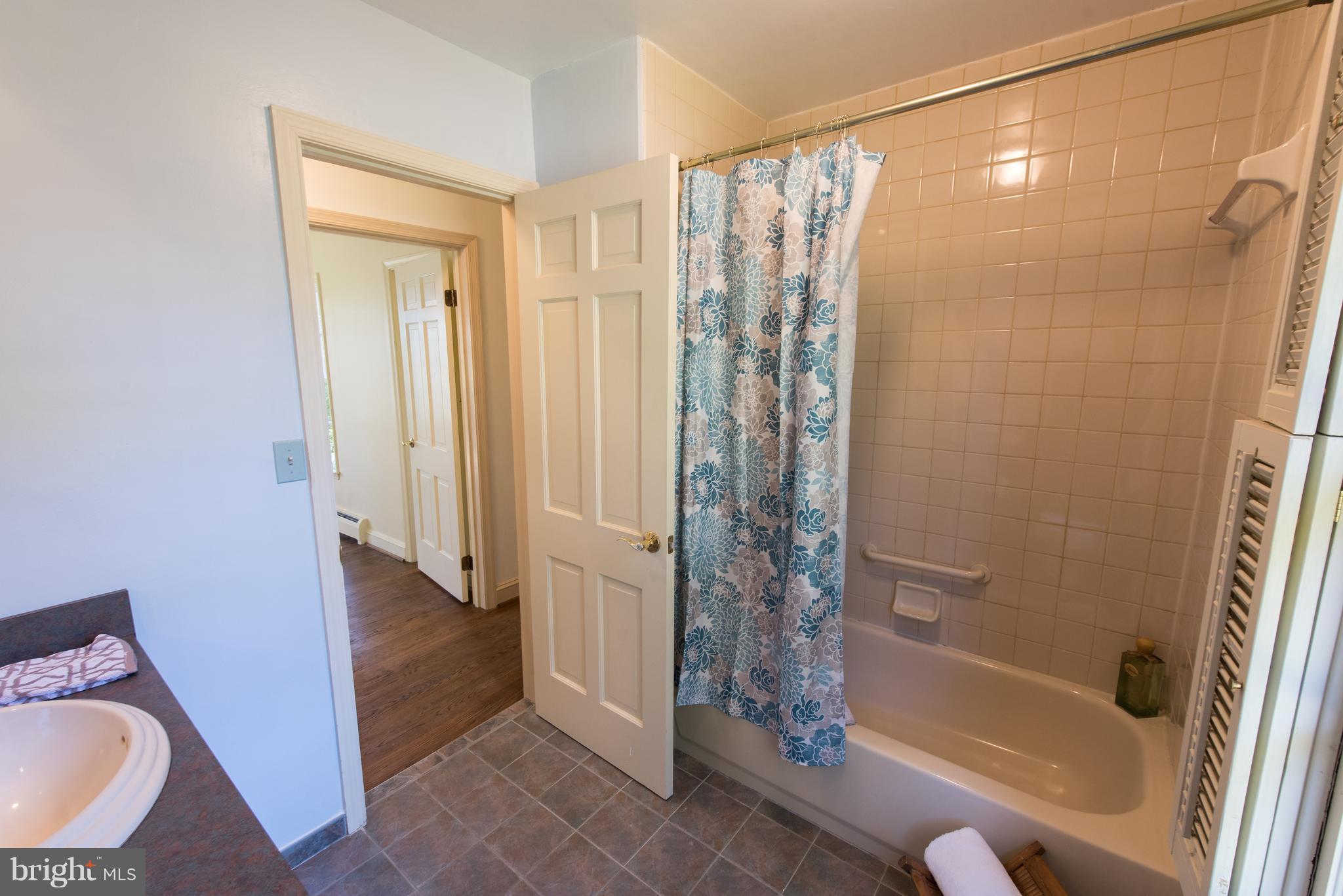 3645 Macalpine Road Ellicott City, MD 21042 - Photo 21 of 30 a bathroom with a tub and shower