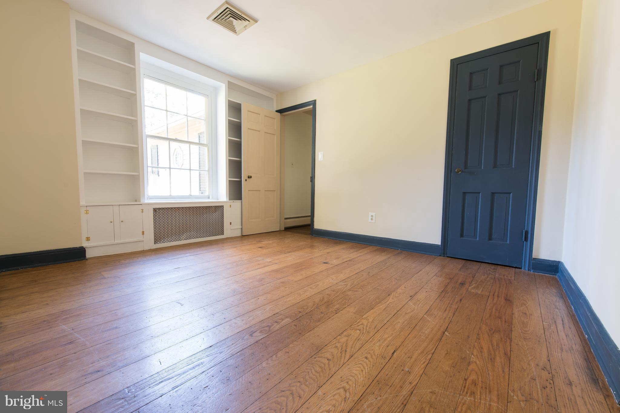 3645 Macalpine Road Ellicott City, MD 21042 - Photo 25 of 30 an empty room with wooden floor and windows