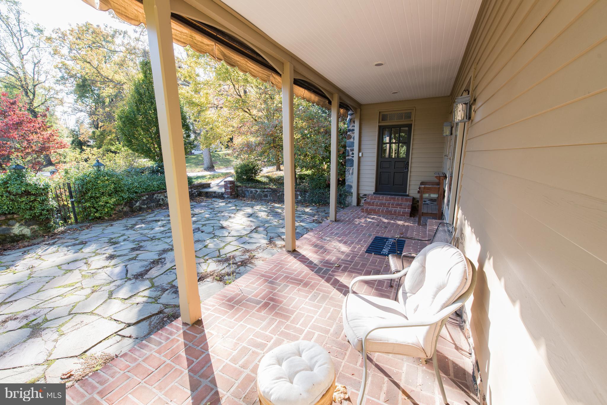 3645 Macalpine Road Ellicott City, MD 21042 - Photo 27 of 30 a view of a porch with chairs and backyard