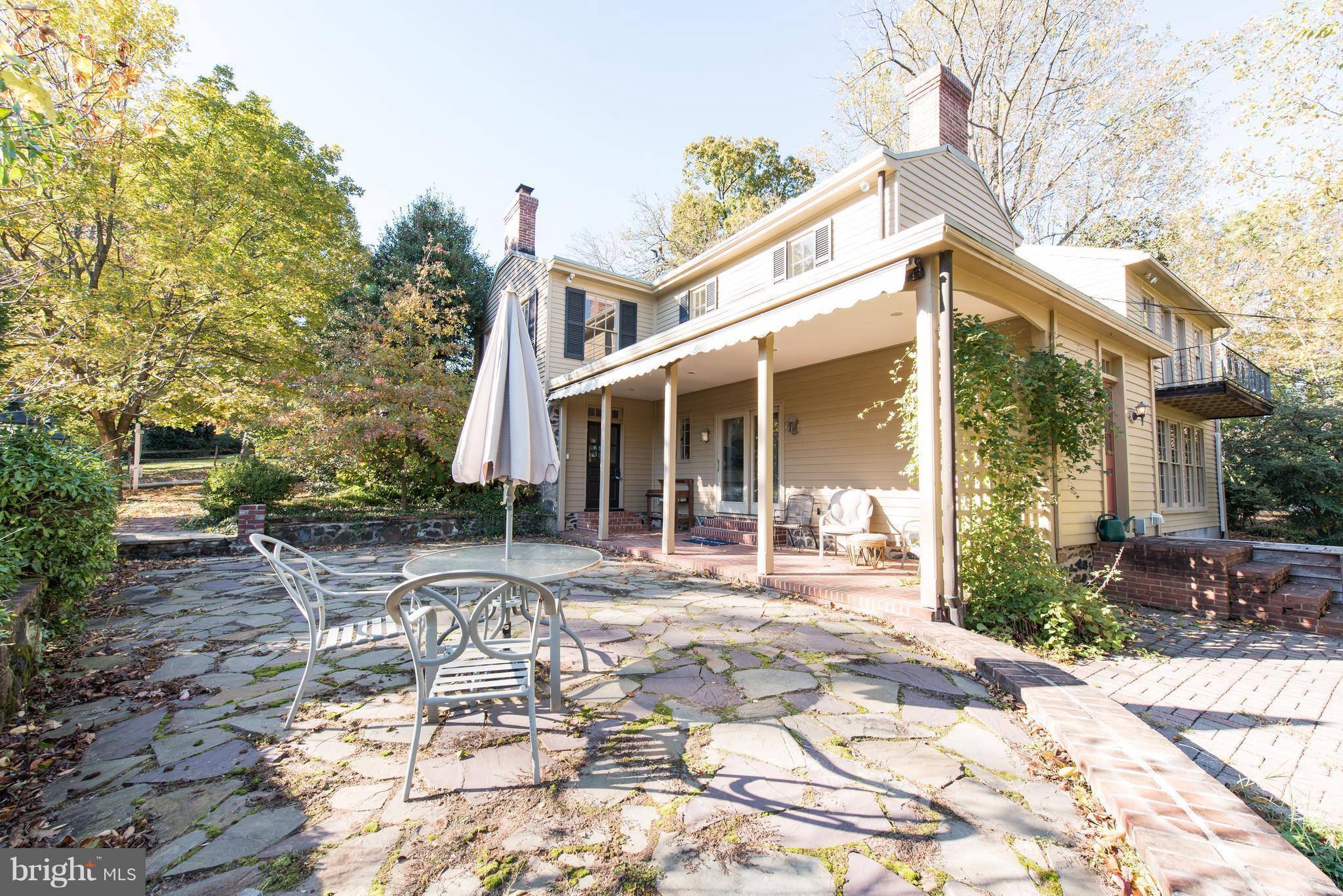 3645 Macalpine Road Ellicott City, MD 21042 - Photo 28 of 30 a front view of a house with a patio