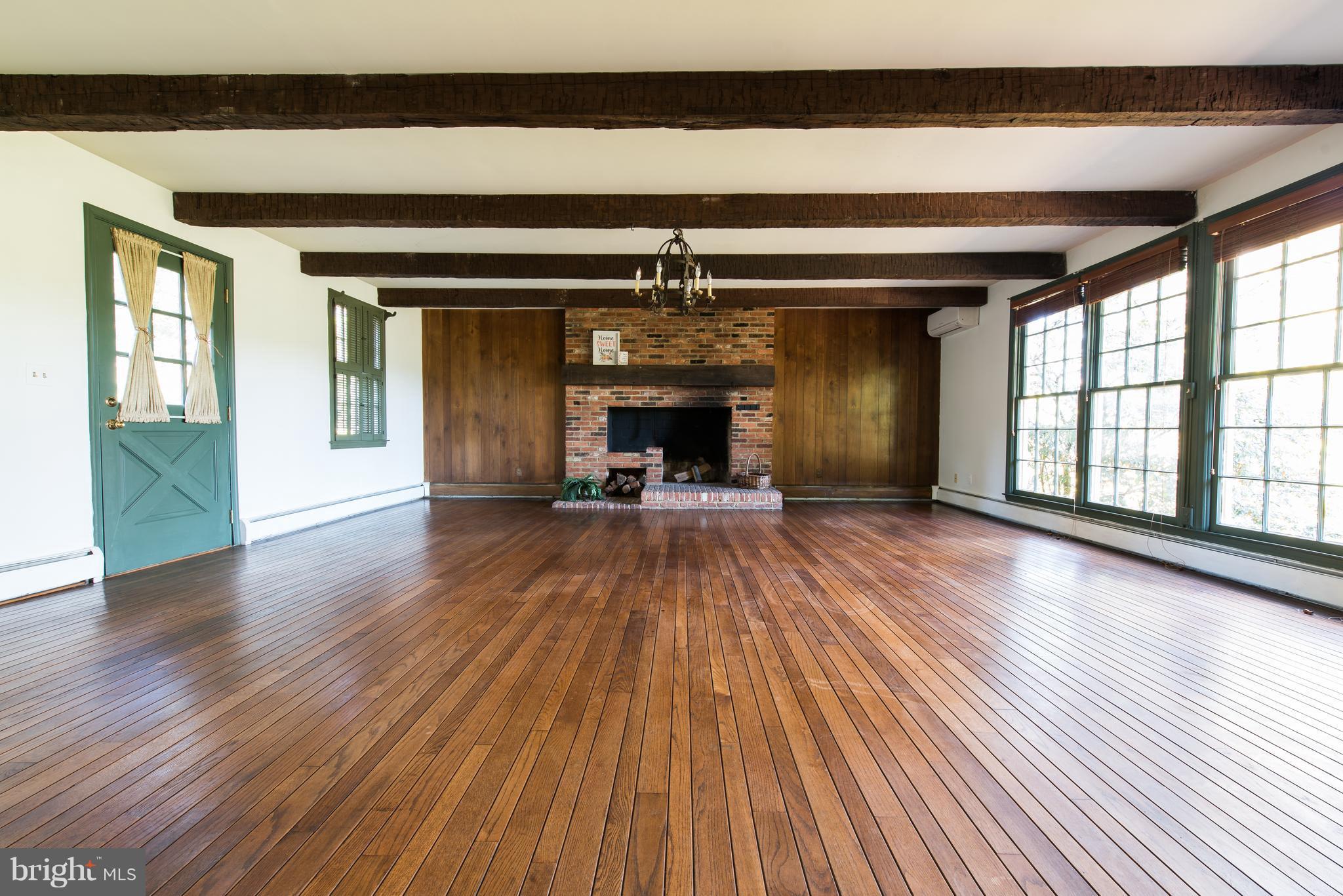 3645 Macalpine Road Ellicott City, MD 21042 - Photo 5 of 30 wooden floor in an empty room with a fireplace