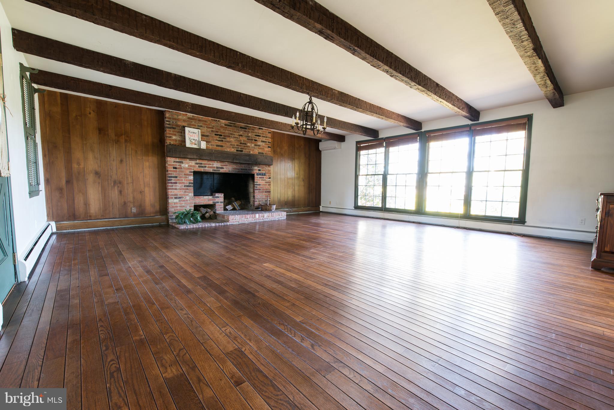 3645 Macalpine Road Ellicott City, MD 21042 - Photo 6 of 30 wooden floor in an empty room with a fireplace