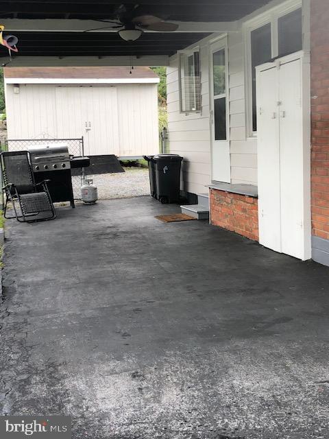 11310 Manse Road Hagerstown, MD 21740 - Photo 3 of 36 Carport with built-in storage unit, gate to yard