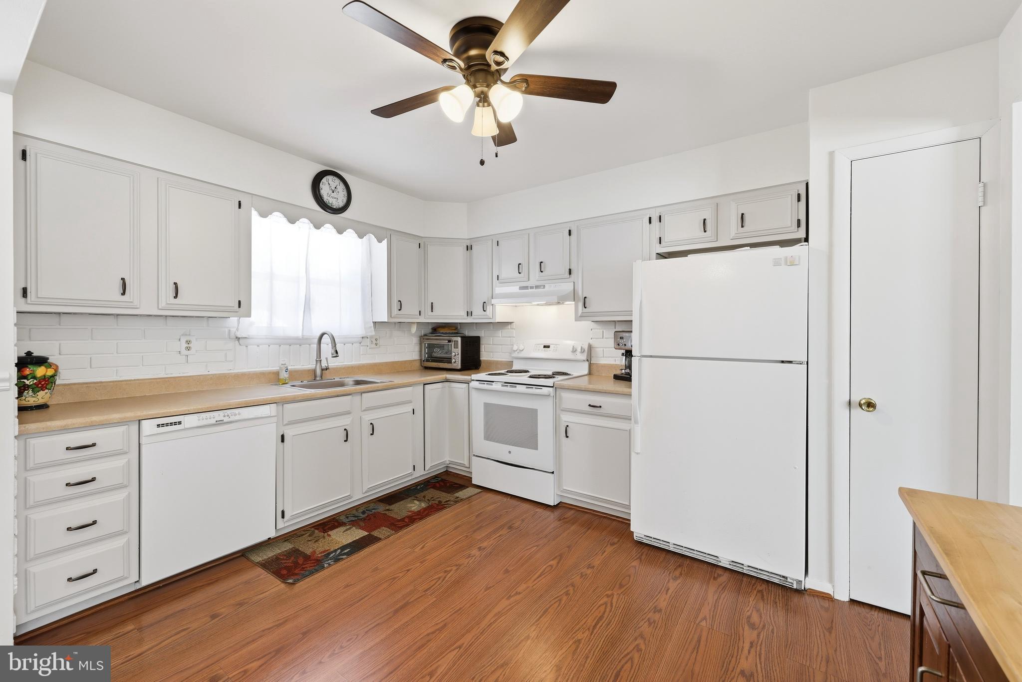 55 Plymouth Road Hammonton, NJ 08037 - Photo 15 of 45 a kitchen with white cabinets and white appliances