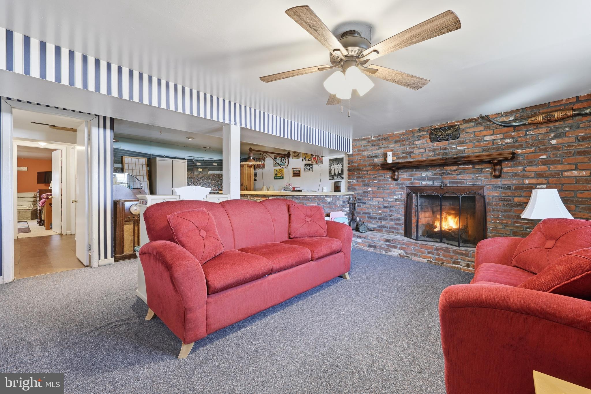 55 Plymouth Road Hammonton, NJ 08037 - Photo 23 of 45 a living room with furniture a fireplace and a chandelier