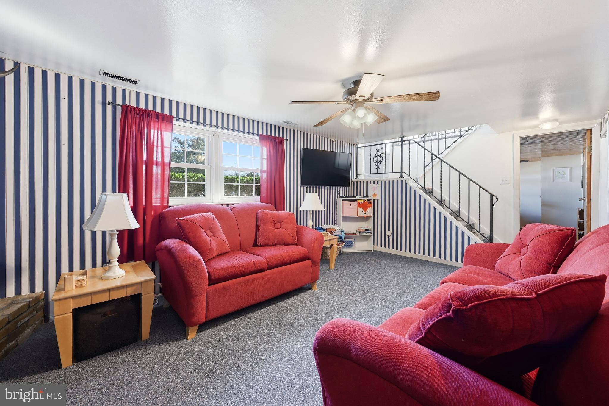 55 Plymouth Road Hammonton, NJ 08037 - Photo 26 of 45 a living room with furniture ceiling fan and a rug