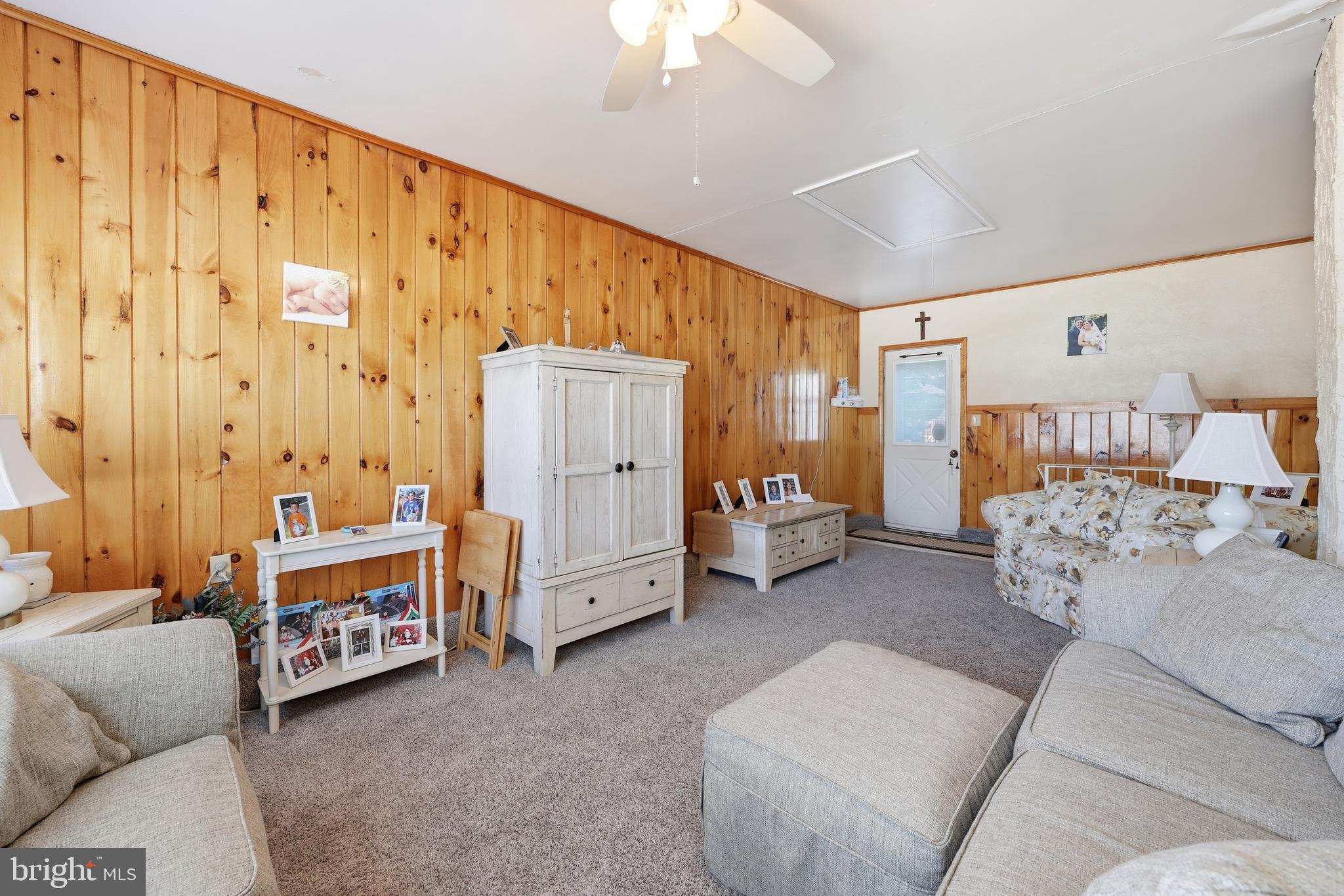 55 Plymouth Road Hammonton, NJ 08037 - Photo 34 of 45 a bedroom with furniture and a chandelier