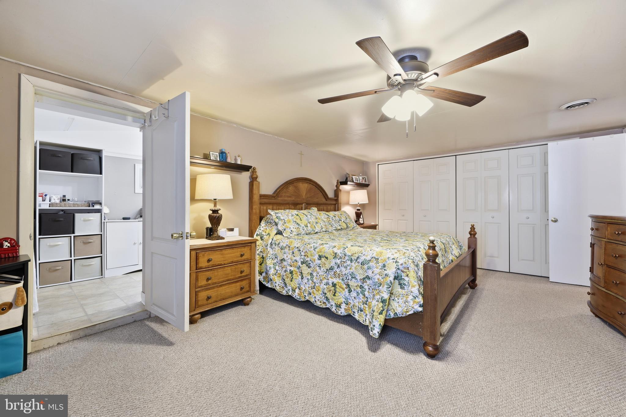55 Plymouth Road Hammonton, NJ 08037 - Photo 37 of 45 a bedroom with a bed and a chandelier