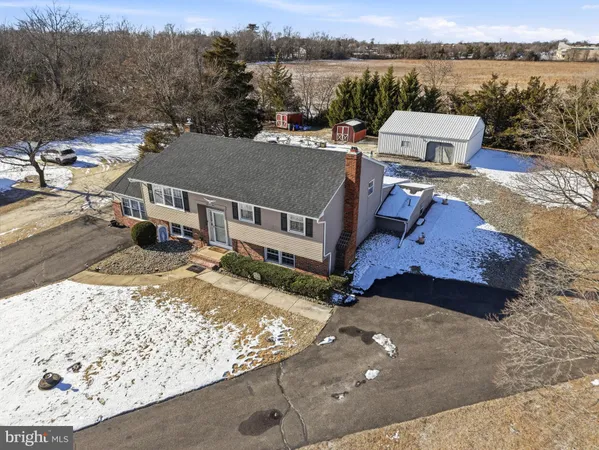 an aerial view of a house with big yard