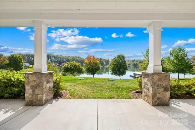 a view of a garden with a building in the background