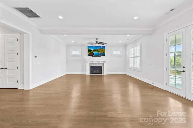 a view of a kitchen with a stove cabinets and wooden floor