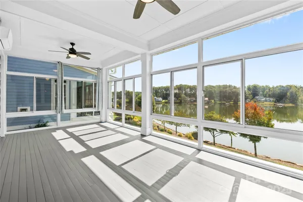 a view of an entryway with wooden floor and door