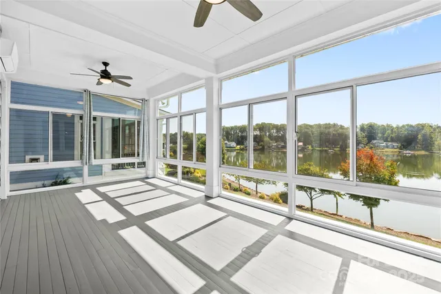 a view of an entryway with wooden floor and door