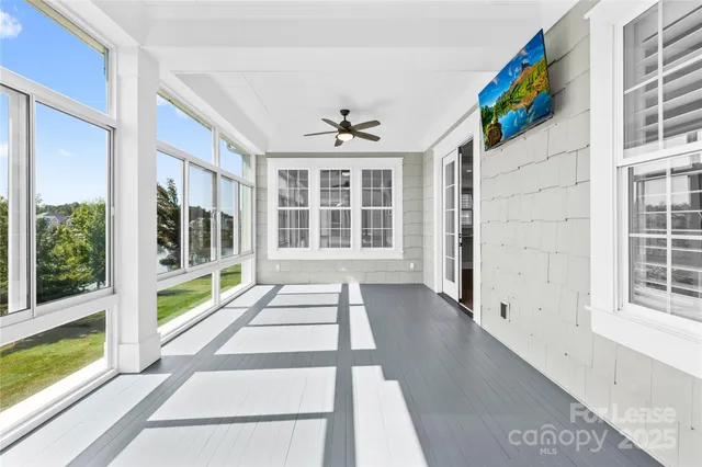 a view of a large window and a red chair