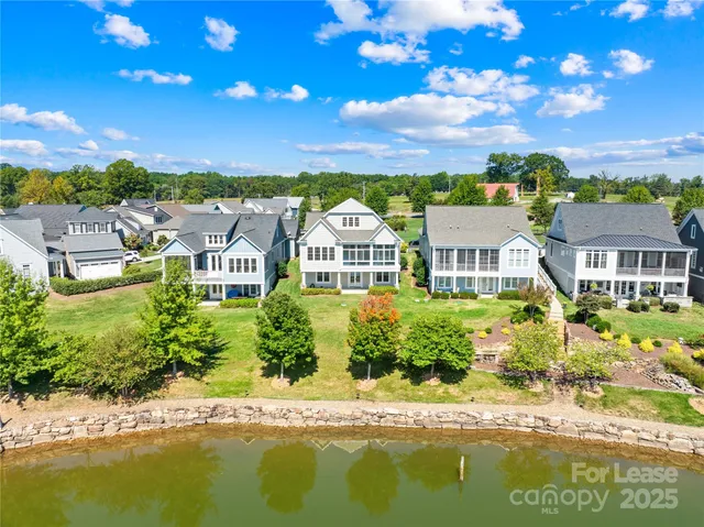 a front view of a house with a lake view