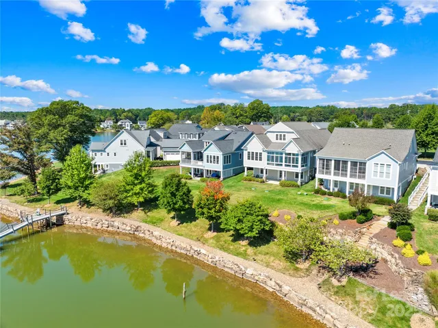 a view of a lake with a house in the background
