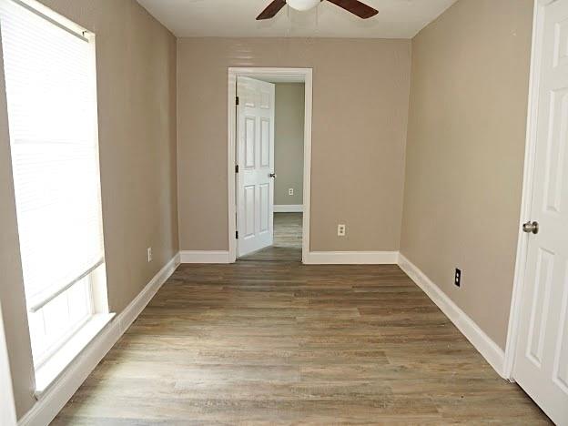 515 Taylor Street Arlington, TX 76011 - Photo 12 of 18 a view of an empty room and wooden floor