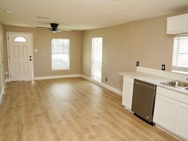 515 Taylor Street Arlington, TX 76011 - Photo 17 of 18 a view of a kitchen with a sink dishwasher and a fireplace
