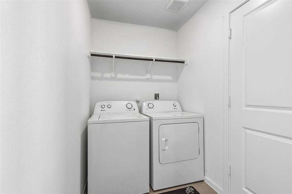 14163 Kempt Drive Pilot Point, TX 76258 - Photo 22 of 29 The well-positioned laundry room provides everyday convenience with direct access to the attached two-car garage, ample space for laundry essentials, and the added bonus of an included washer and dryer.