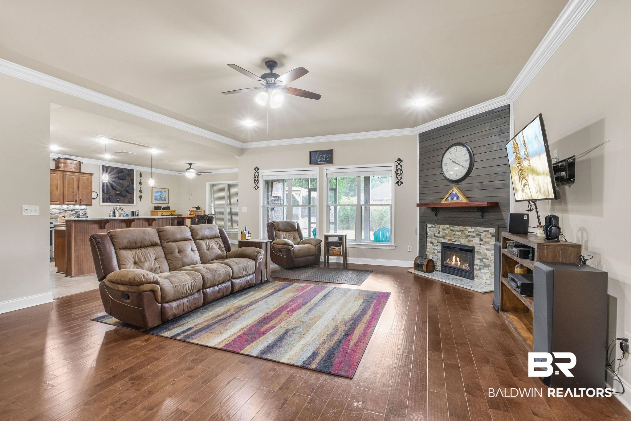 1086 Destin Avenue Foley, AL 36535 - Photo 7 of 30 Living room with ornamental molding, a fireplace, dark hardwood / wood-style floors, and ceiling fan