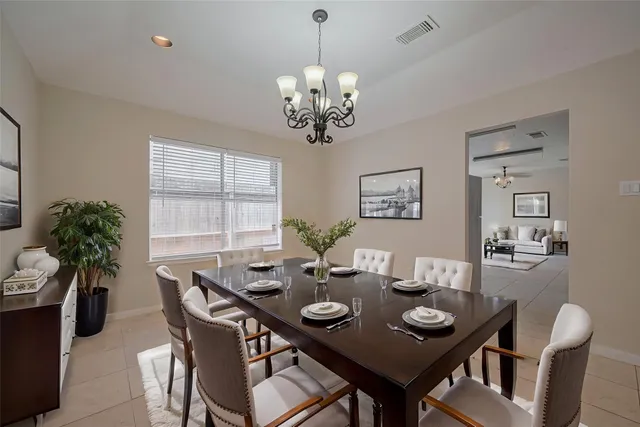 a view of a dining room and a chandelier