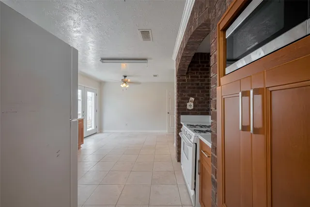 a view of a kitchen with kitchen and entryway