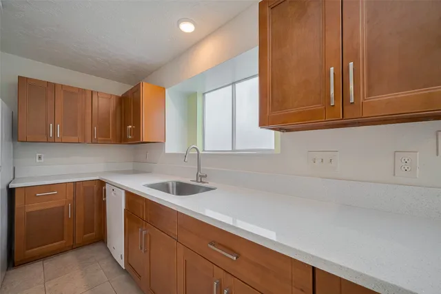 a kitchen with a sink and cabinets